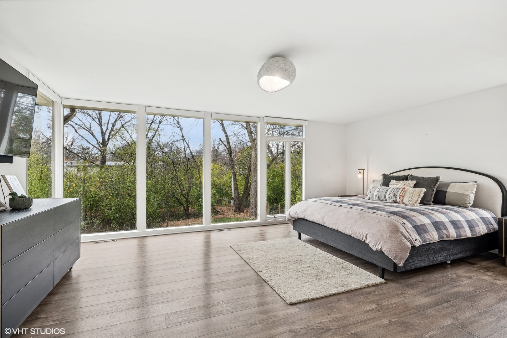 688 East Old Elm Road Lake Forest, IL 60045 - Photo 20 of 40 a bedroom with a large bed and a large window