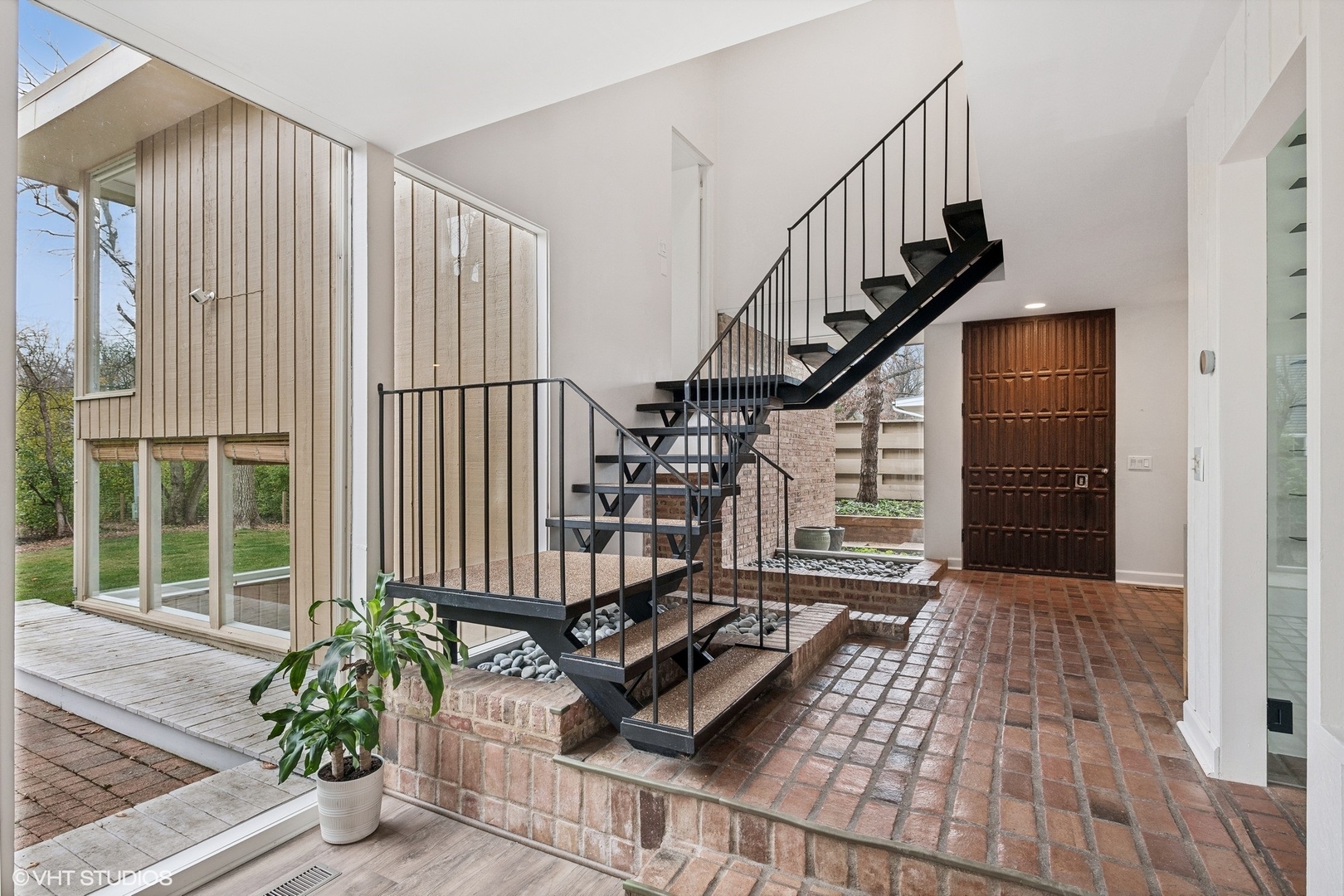 688 East Old Elm Road Lake Forest, IL 60045 - Photo 2 of 40 a view of entryway with wooden floor and stairs