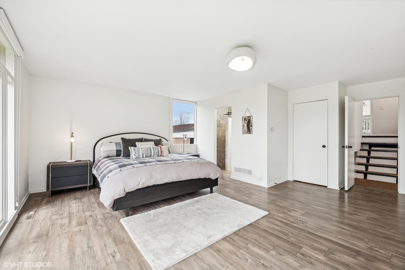 688 East Old Elm Road Lake Forest, IL 60045 - Photo 21 of 40 a spacious bedroom with a bed and a table