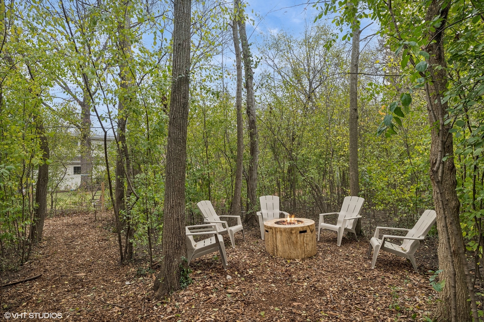688 East Old Elm Road Lake Forest, IL 60045 - Photo 34 of 40 a view of a chair and table in the backyard