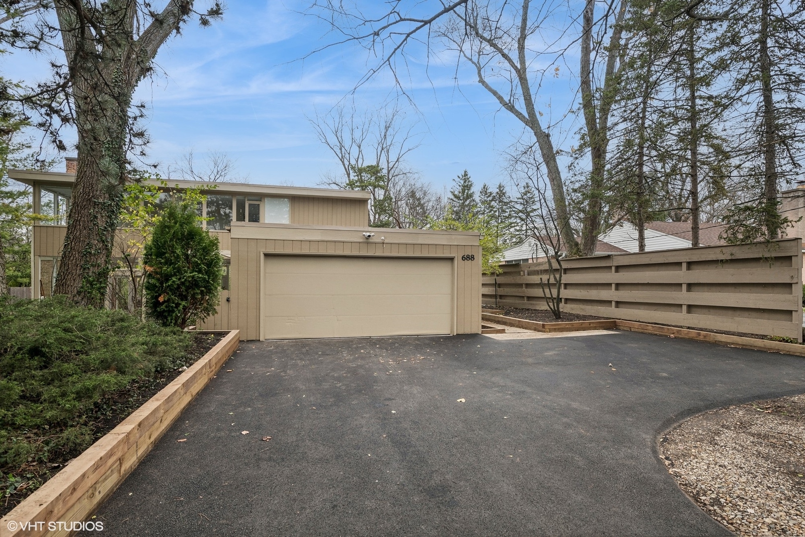 688 East Old Elm Road Lake Forest, IL 60045 - Photo 36 of 40 a view of a house with a yard and garage