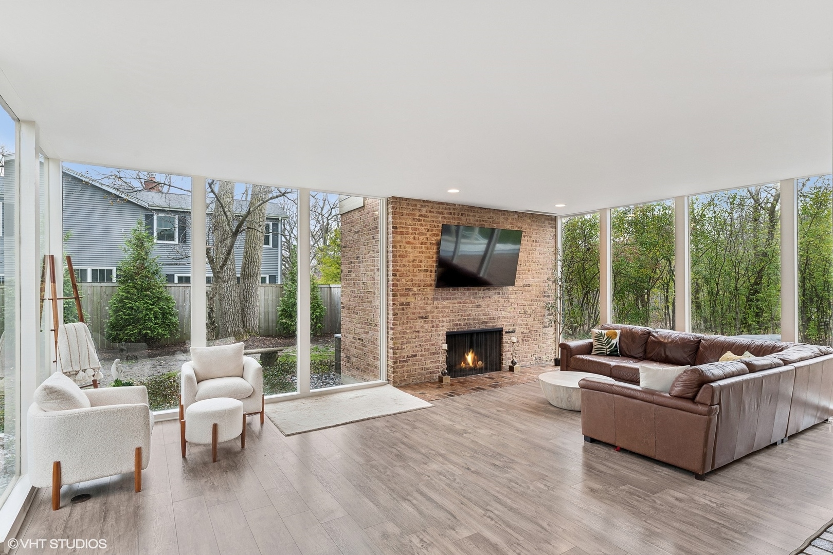 688 East Old Elm Road Lake Forest, IL 60045 - Photo 10 of 40 a living room with furniture flat screen tv and a fireplace