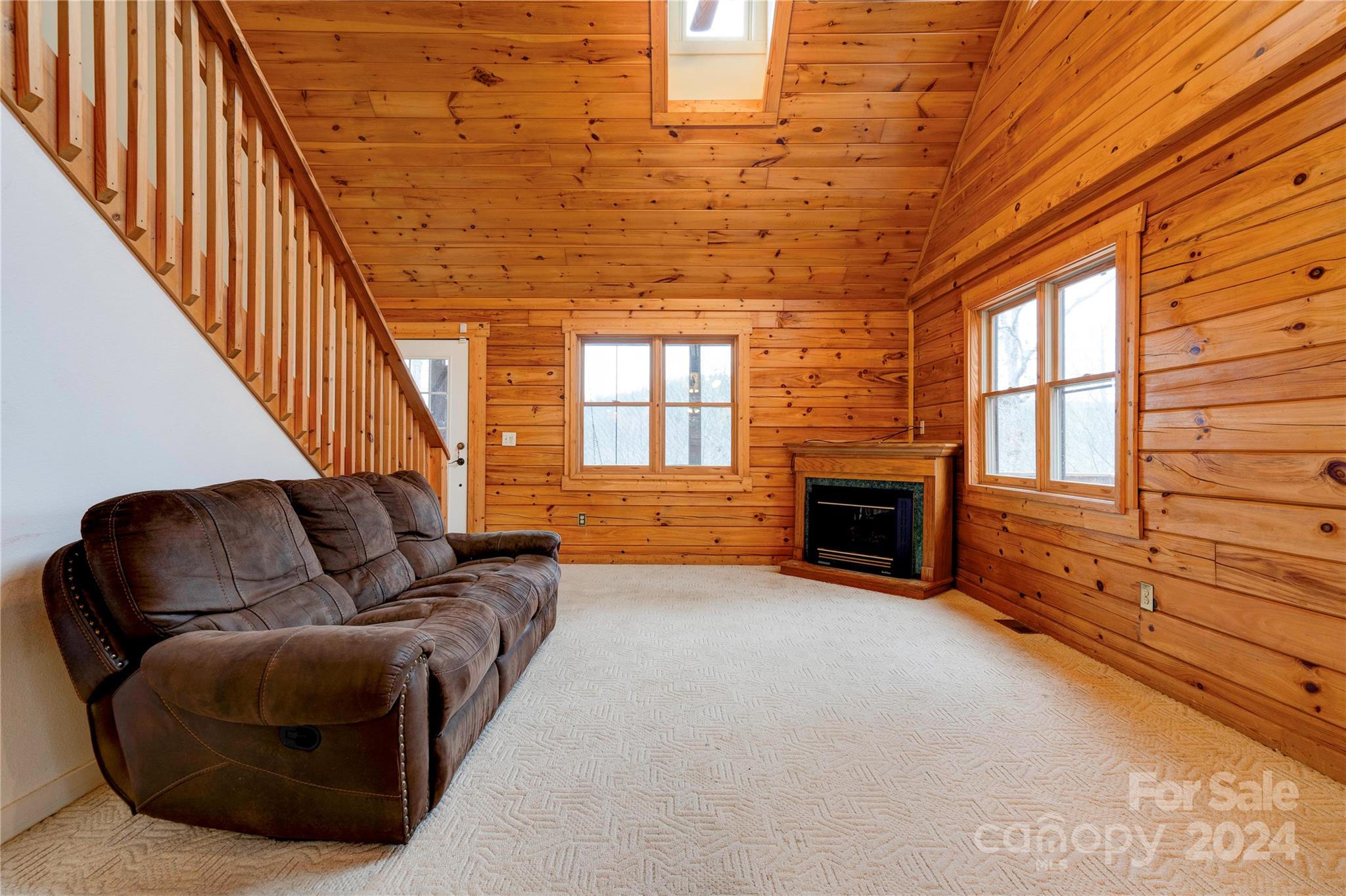273 Sasafras Ridge Rutherfordton, NC 28139 - Photo 16 of 41 a living room with furniture a fireplace and a large window