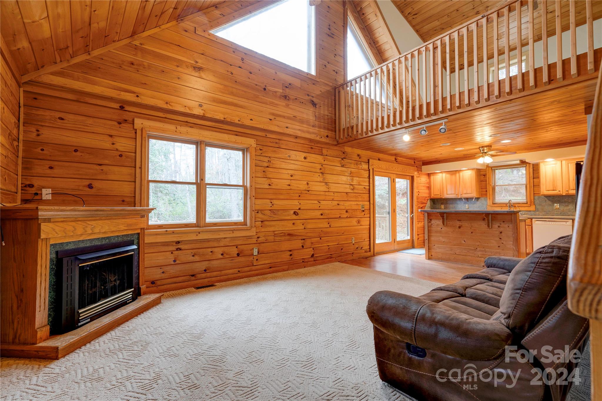 273 Sasafras Ridge Rutherfordton, NC 28139 - Photo 18 of 41 a living room with furniture a fireplace and a ceiling fan