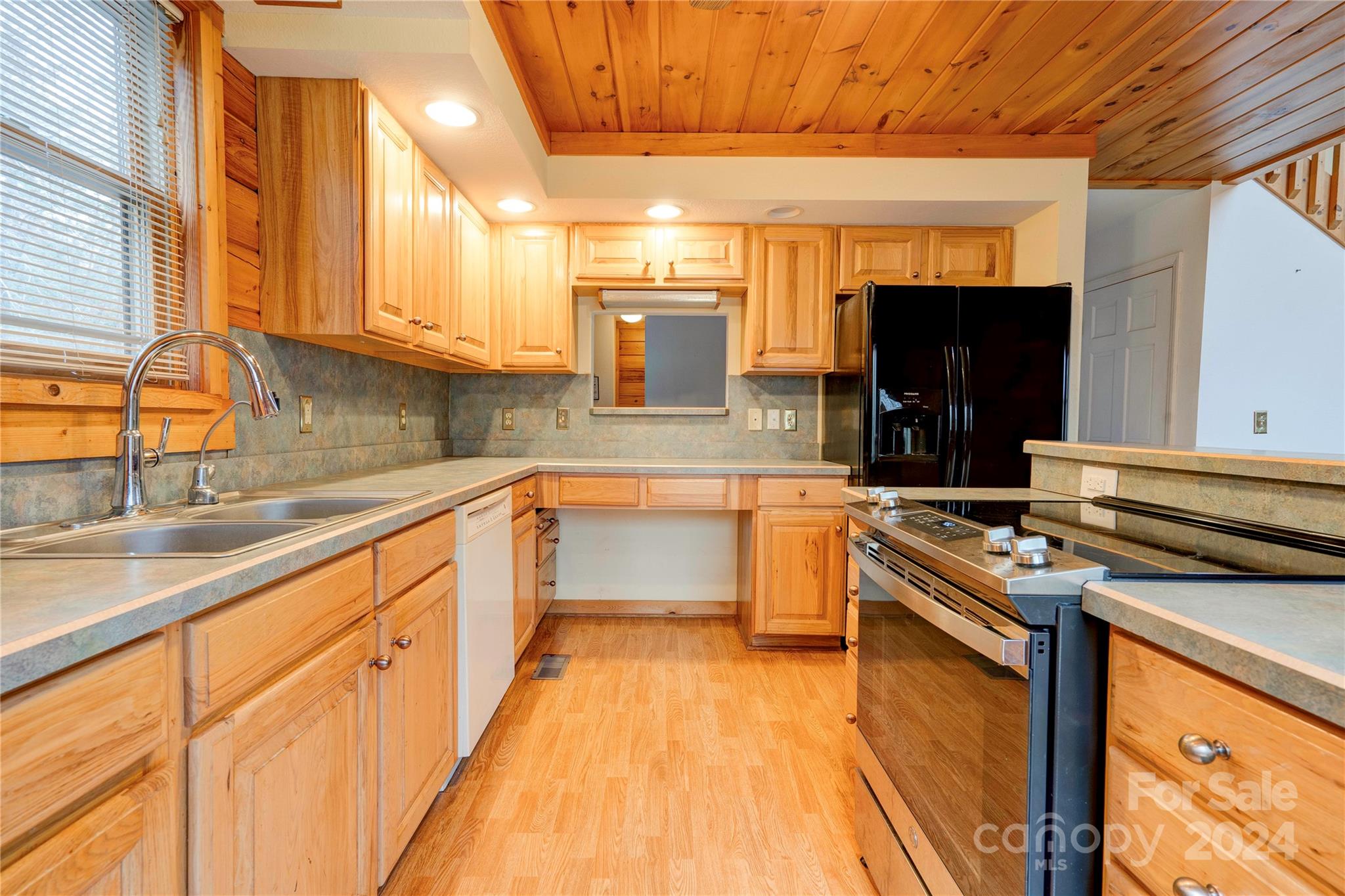 273 Sasafras Ridge Rutherfordton, NC 28139 - Photo 21 of 41 a kitchen with stainless steel appliances granite countertop a sink and a stove
