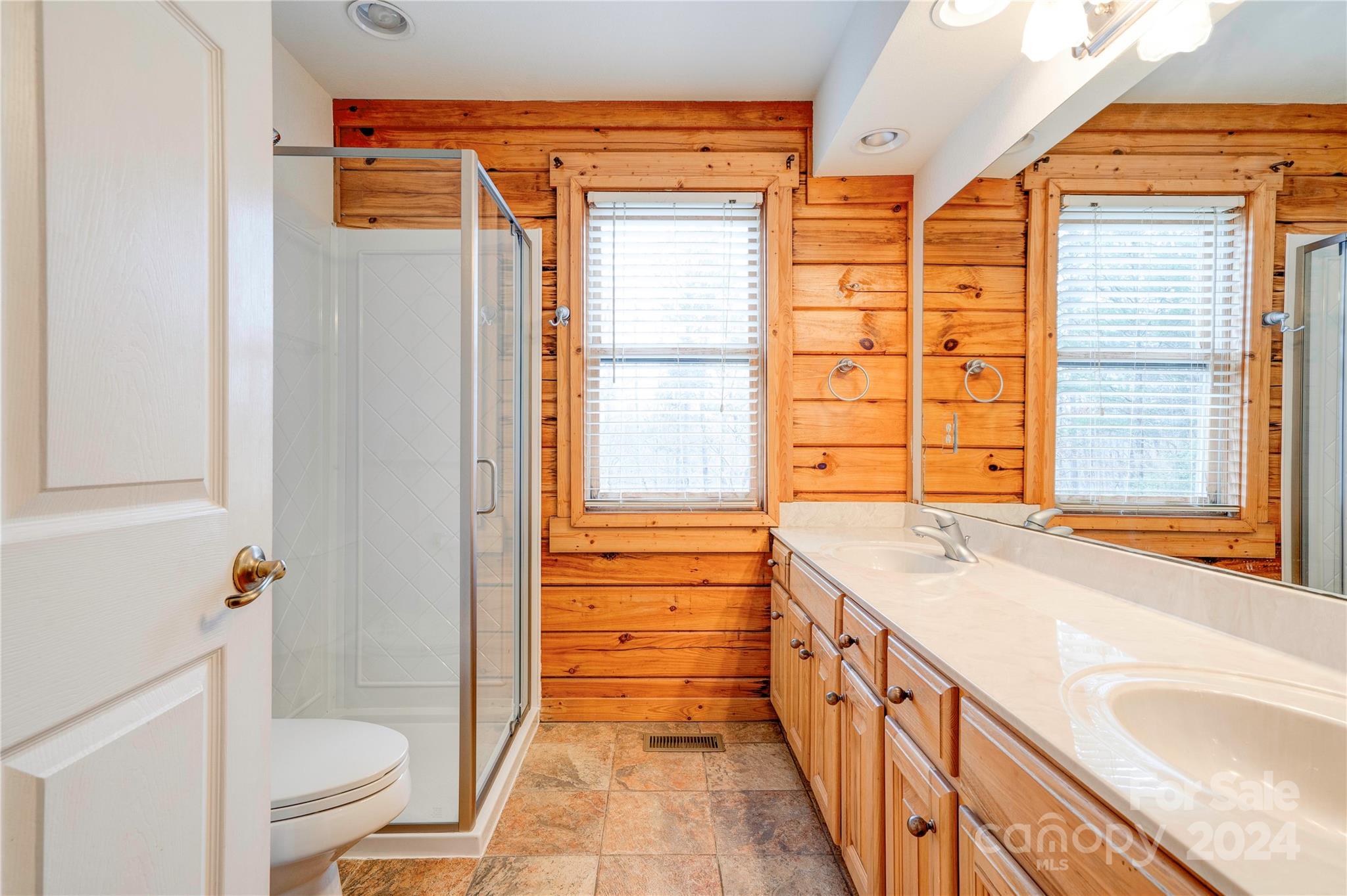 273 Sasafras Ridge Rutherfordton, NC 28139 - Photo 29 of 41 a bathroom with a granite countertop sink and a shower