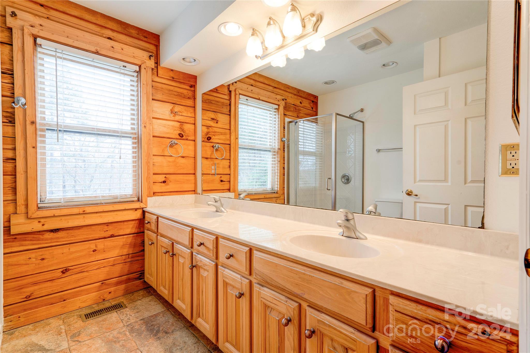 273 Sasafras Ridge Rutherfordton, NC 28139 - Photo 30 of 41 a bathroom with sinks a vanity and a large mirror