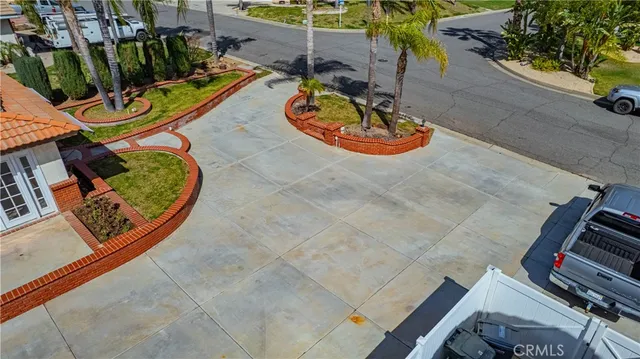 a view of a livingroom with wooden floor and a ceiling fan