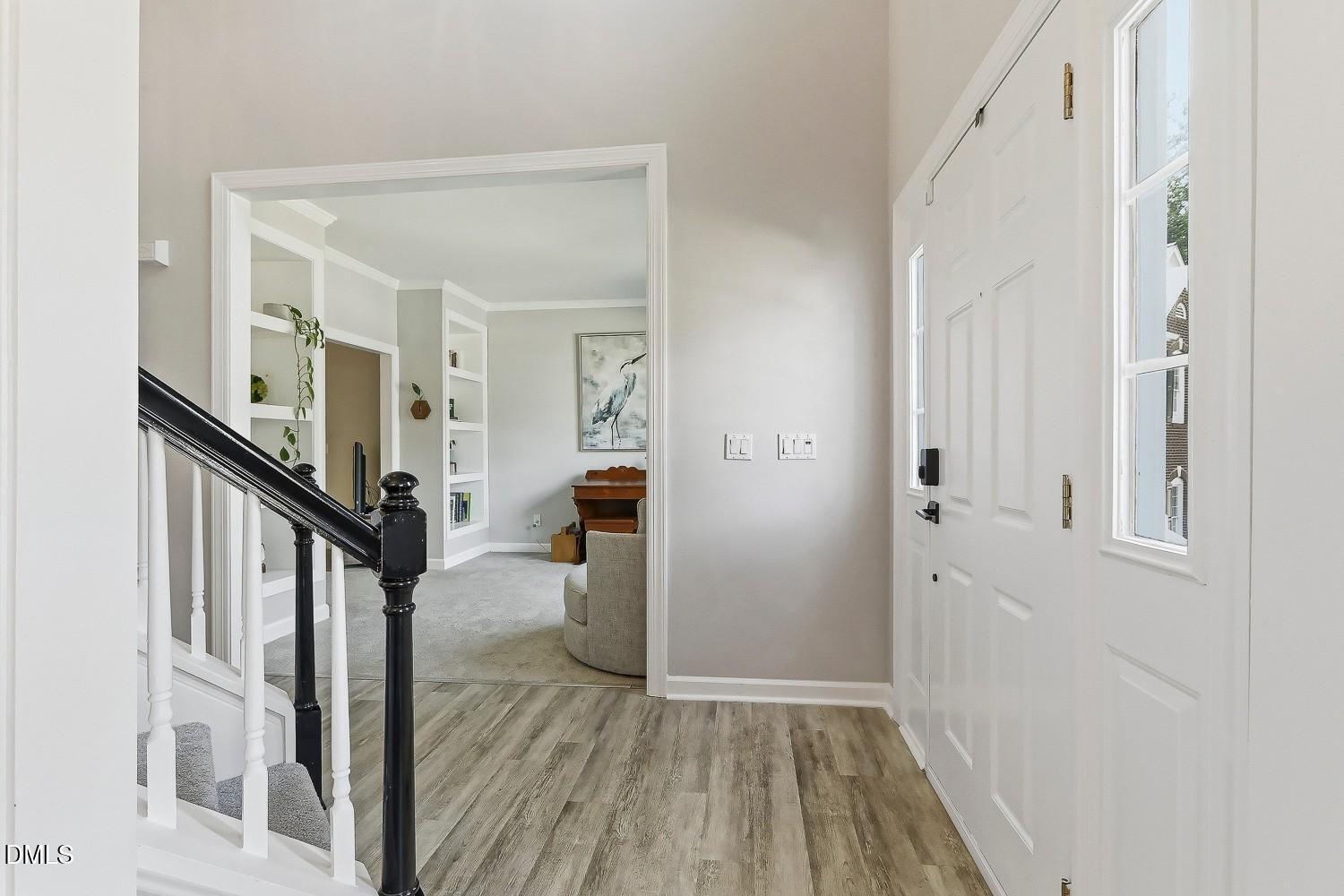 4001 Batiste Road Raleigh, NC 27613 - Photo 7 of 63 a view of a livingroom from a hallway