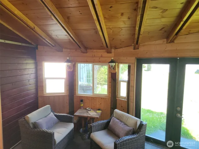 a living room with furniture and a window
