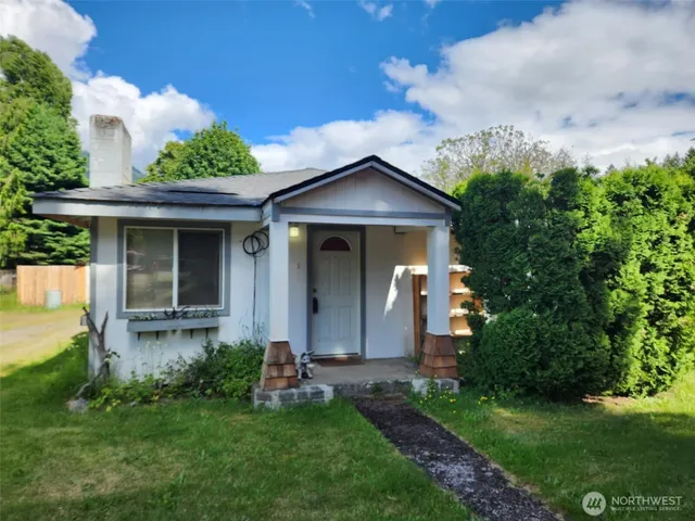 a view of a house with a yard and plants