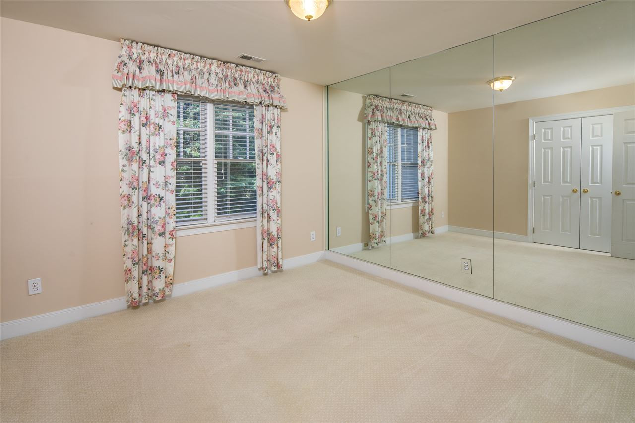 2709 Amstel Way Raleigh, NC 27613 - Photo 20 of 30 Large secondary bedroom with wall of mirrors and generous closet space! Perfect for the ballerina in your little girl! Bedroom