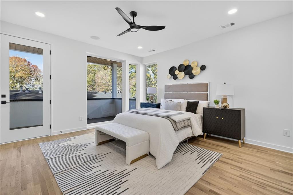 163 Walthall Street Southeast, Unit B Atlanta, GA 30316 - Photo 15 of 37 a bedroom with a large bed and a window