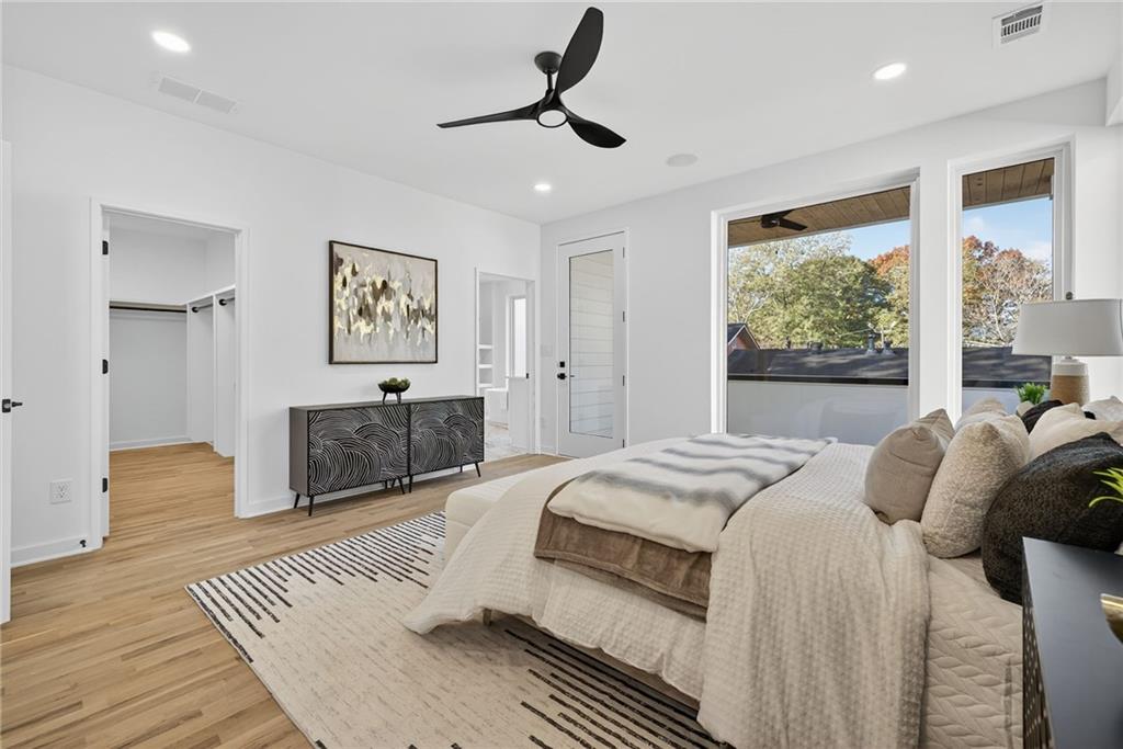 163 Walthall Street Southeast, Unit B Atlanta, GA 30316 - Photo 16 of 37 a bedroom with a large bed and a window