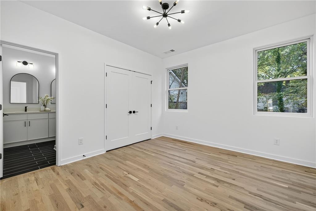 163 Walthall Street Southeast, Unit B Atlanta, GA 30316 - Photo 30 of 37 wooden floor in an empty room with a window