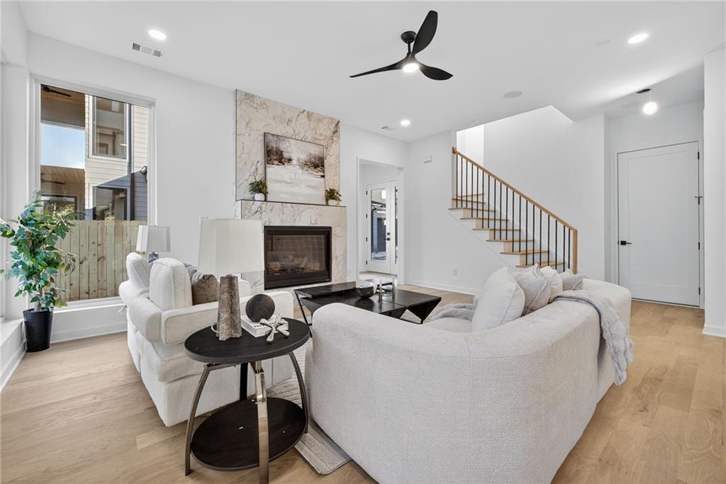 163 Walthall Street Southeast, Unit B Atlanta, GA 30316 - Photo 4 of 37 a living room with furniture and a fireplace