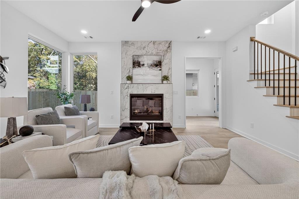 163 Walthall Street Southeast, Unit B Atlanta, GA 30316 - Photo 5 of 37 a living room with furniture and a fireplace