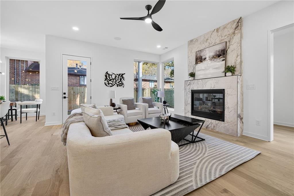 163 Walthall Street Southeast, Unit B Atlanta, GA 30316 - Photo 6 of 37 a living room with furniture and a fireplace