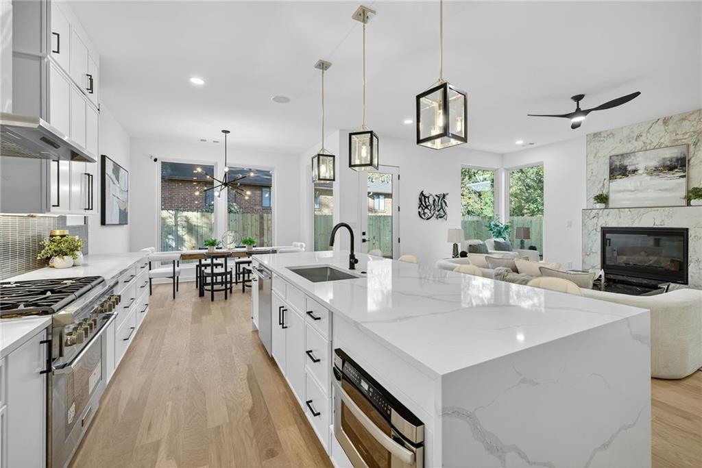 163 Walthall Street Southeast, Unit B Atlanta, GA 30316 - Photo 7 of 37 a kitchen with sink stove and cabinets