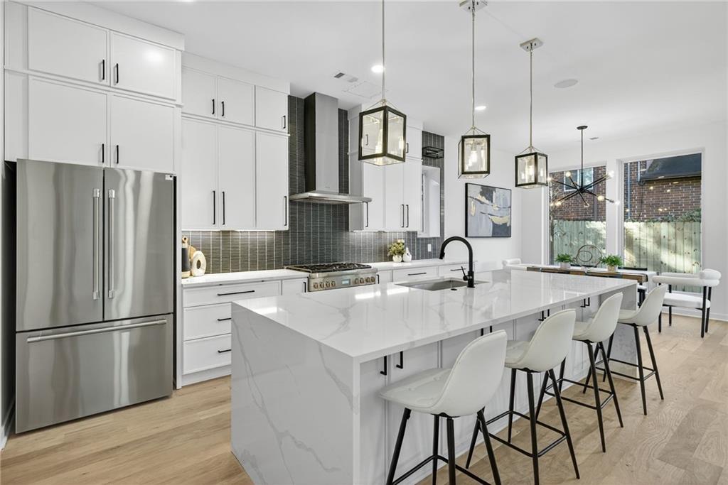163 Walthall Street Southeast, Unit B Atlanta, GA 30316 - Photo 9 of 37 a kitchen with stainless steel appliances granite countertop a sink a stove and a refrigerator