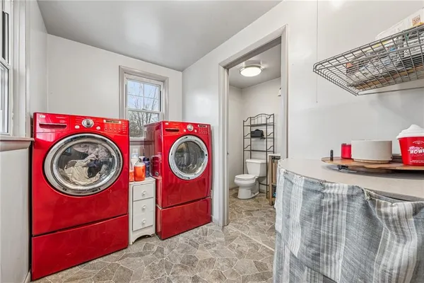 a view of storage and utility room with washer and dryer