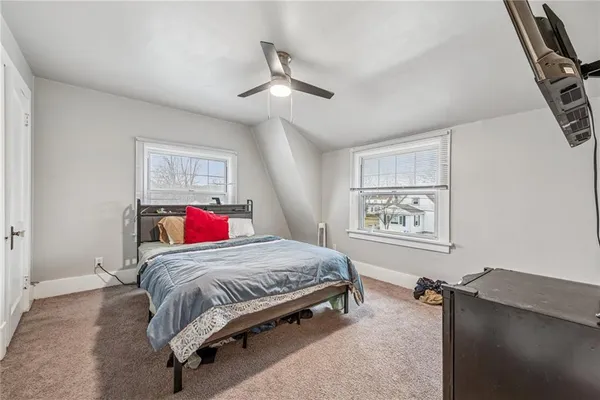 a bedroom with a bed and cabinets