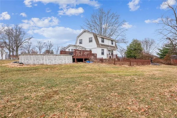 a large tree in front of a house