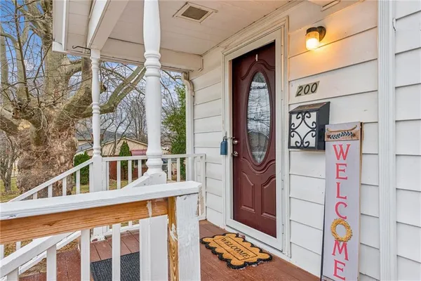 a front view of a building with sign board