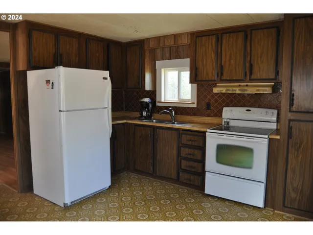 a room with a window and a wooden door
