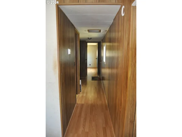 a view of a living room with a flat screen tv