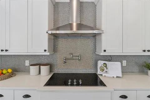 a view of entryway with wooden floor and furniture