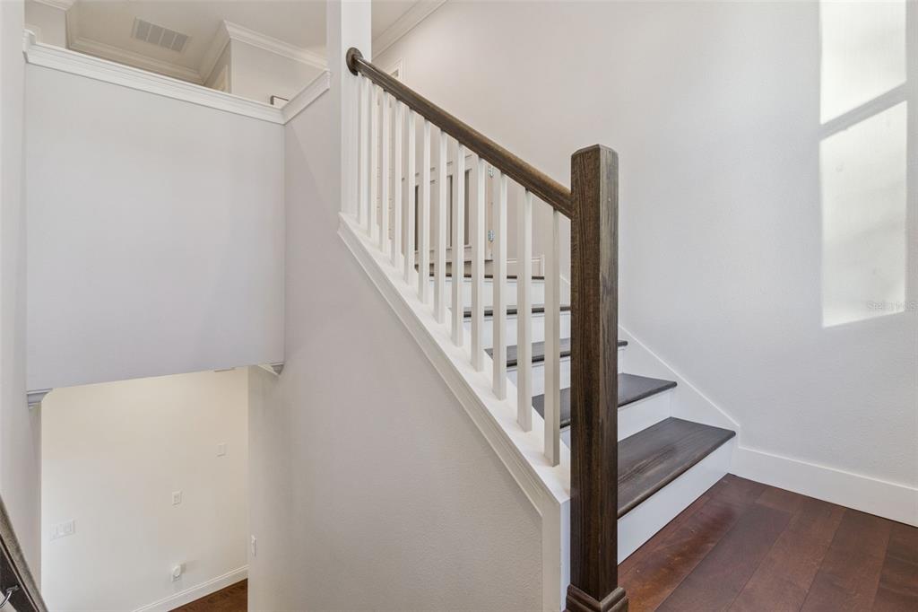 5018 Monet Avenue Belle Isle, FL 32812 - Photo 22 of 56 a view of staircase with railing and white walls
