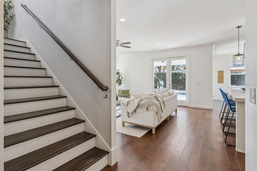 5018 Monet Avenue Belle Isle, FL 32812 - Photo 23 of 56 a bedroom with wooden floors and a bed