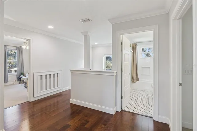 a bedroom with a bed and cabinet