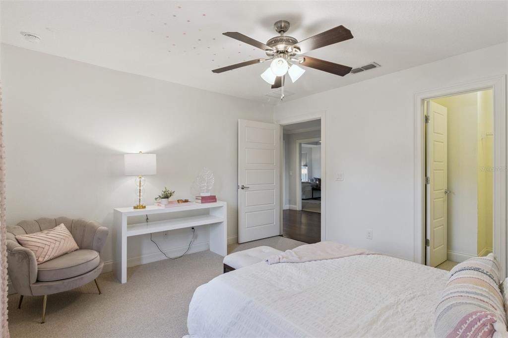 5018 Monet Avenue Belle Isle, FL 32812 - Photo 33 of 56 a bedroom with a bed and a chandelier