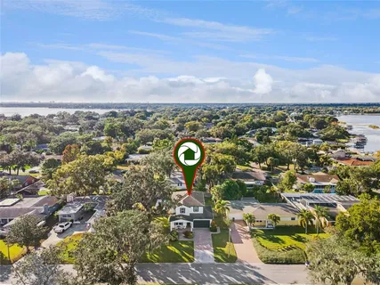 an aerial view of residential houses with outdoor space
