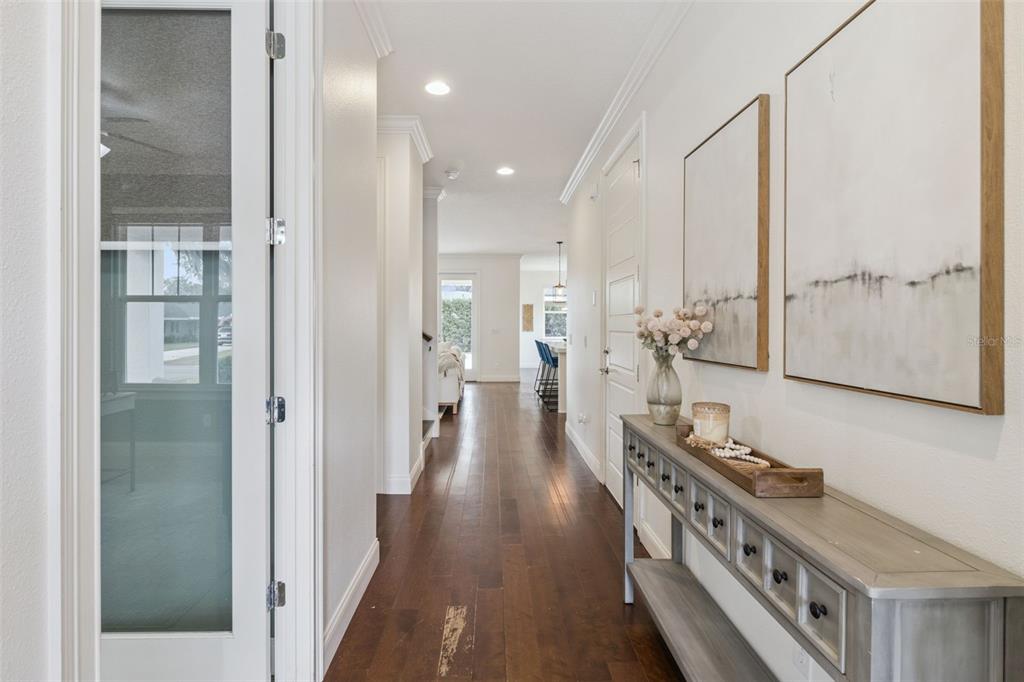 5018 Monet Avenue Belle Isle, FL 32812 - Photo 9 of 56 a view of a hallway with wooden floor and windows