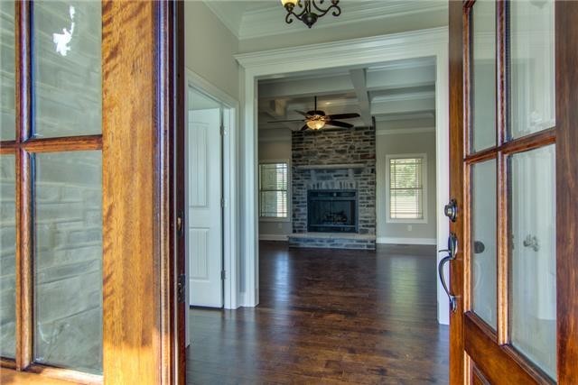 427 Favre Circle Winchester, TN 37398 - Photo 3 of 19 a view of empty room with wooden floor and fireplace