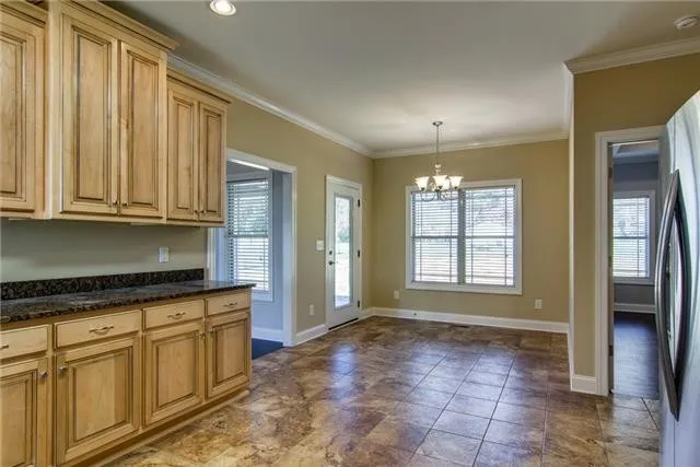 a view of a kitchen with electric appliances