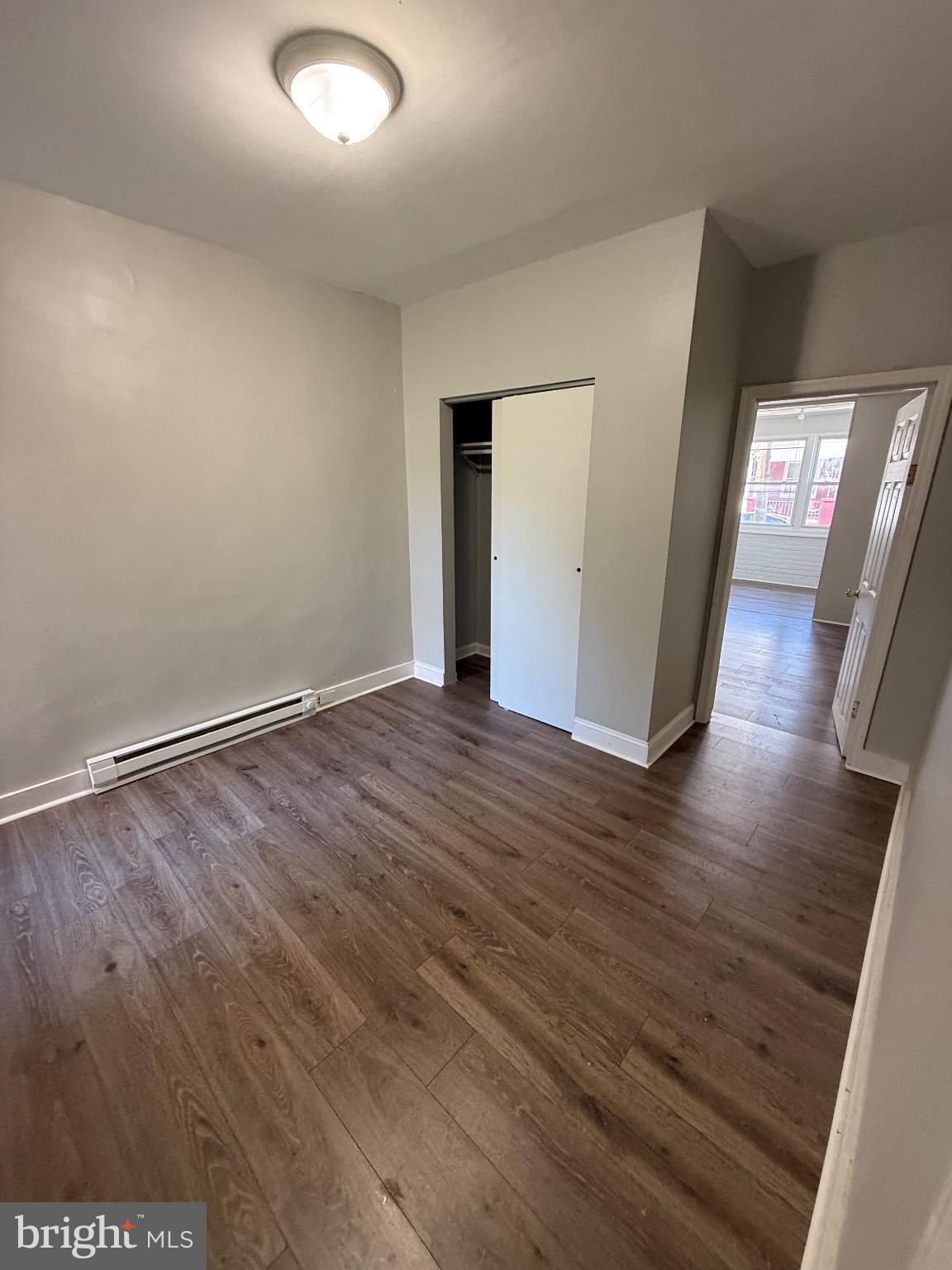 41 North Keystone Avenue Upper Darby, PA 19082 - Photo 1 of 15 a view of an empty room with wooden floor