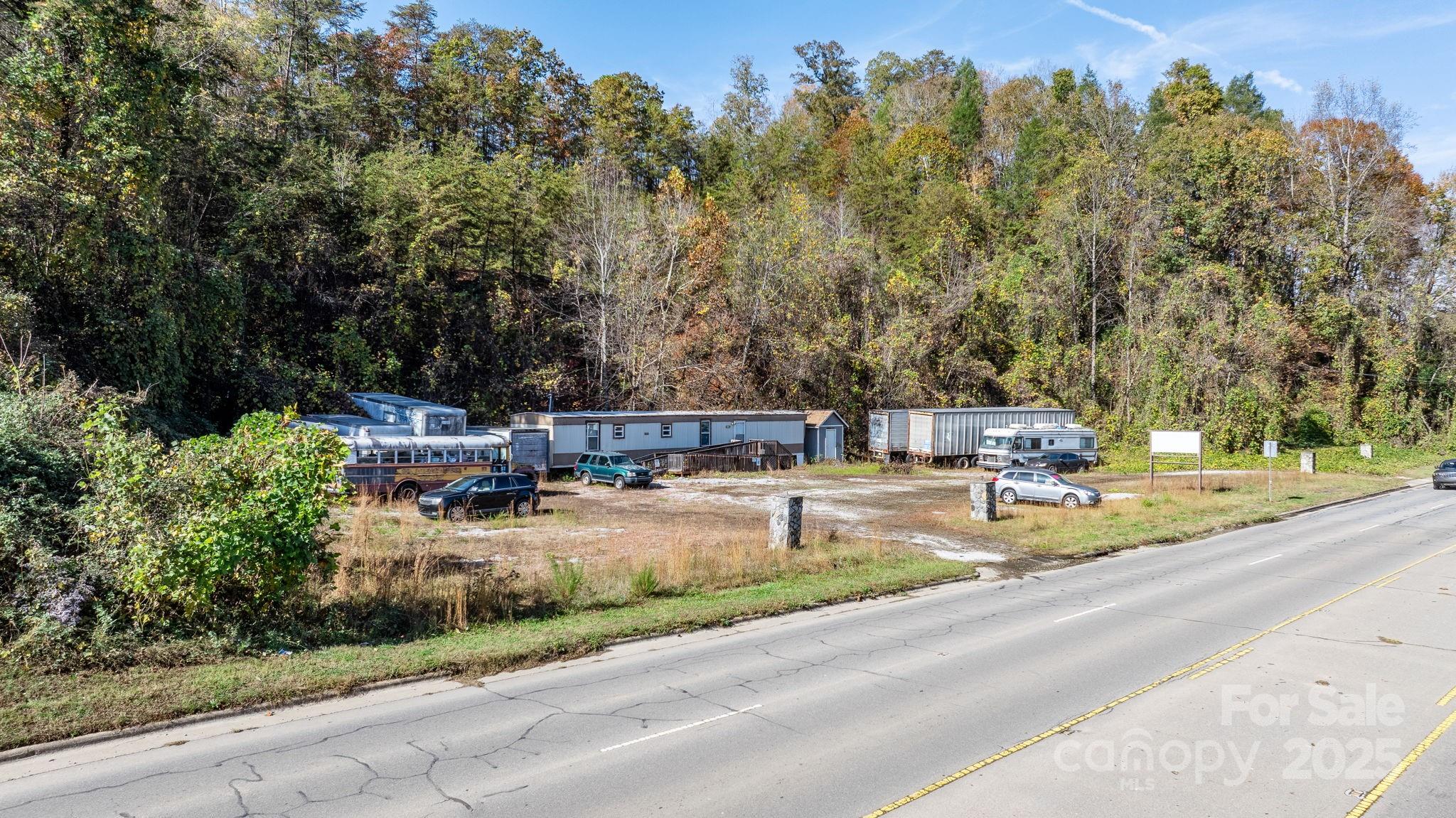 1965 North Main Street Marion, NC 28752 - Photo 1 of 23 a view of a swimming pool and trees in the background