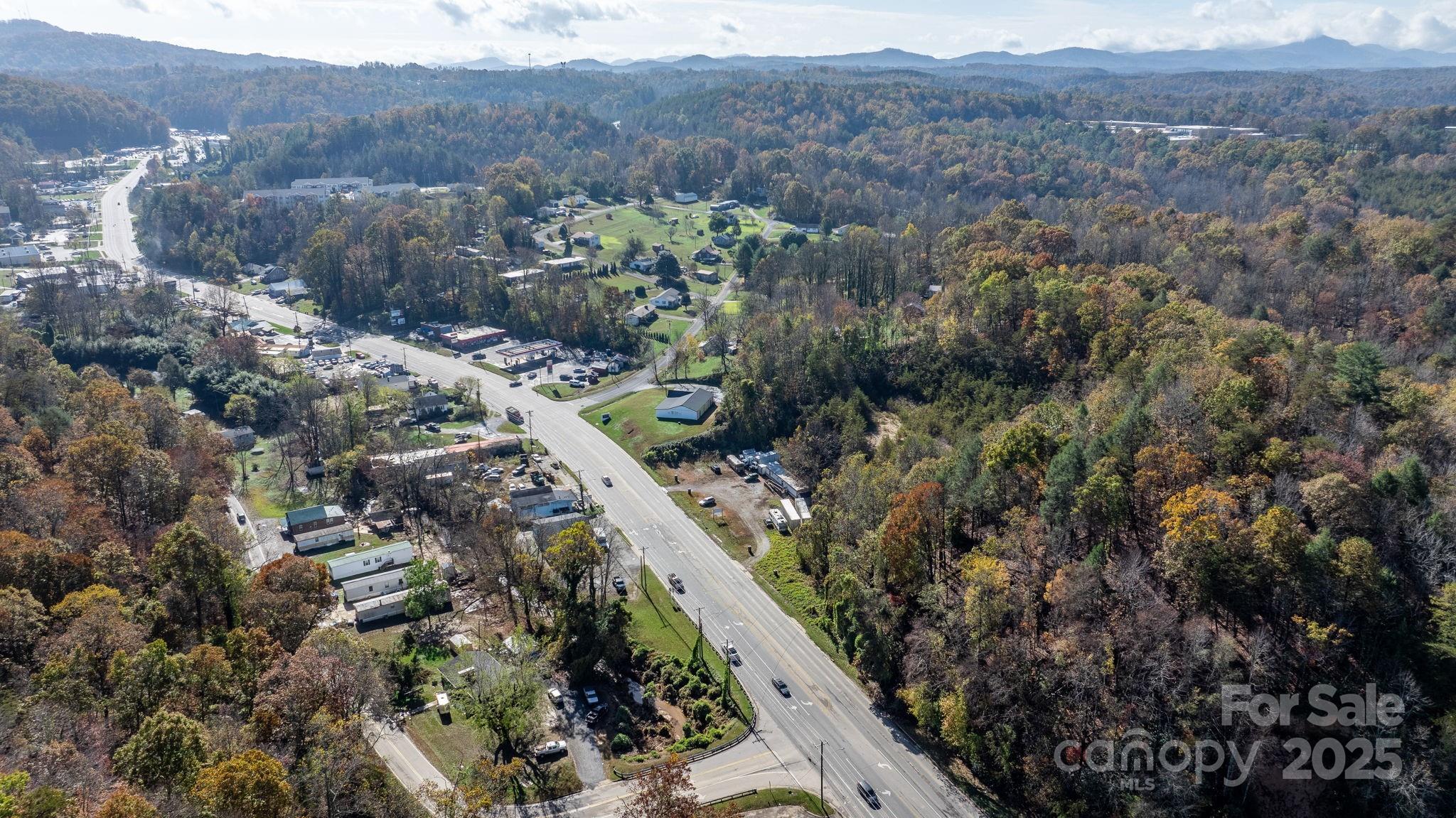 1965 North Main Street Marion, NC 28752 - Photo 21 of 23 a view of a forest with mountains in the background