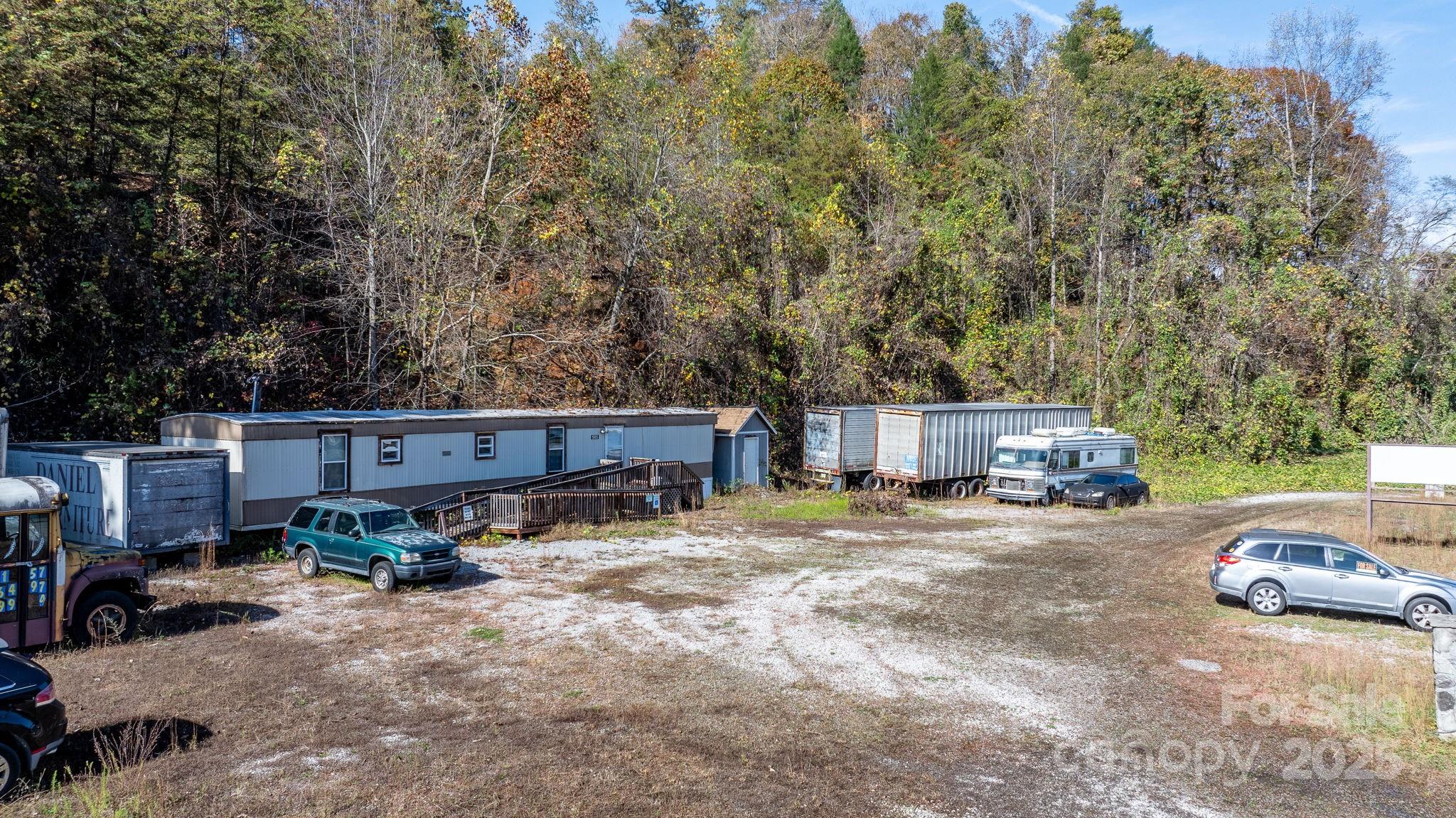 1965 North Main Street Marion, NC 28752 - Photo 7 of 23 a view of a cars parked in front of a house