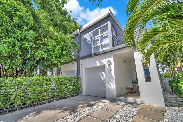 a view of a building with a tree