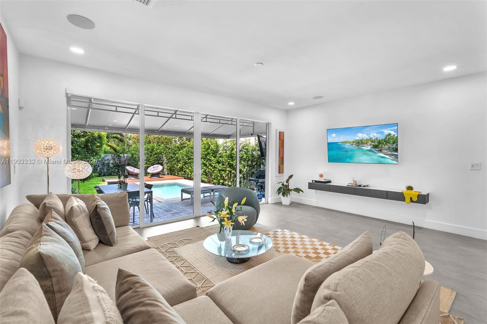 3167 Southwest 25th Street, Unit 1 Miami, FL 33133 - Photo 16 of 42 a living room with furniture and a large window