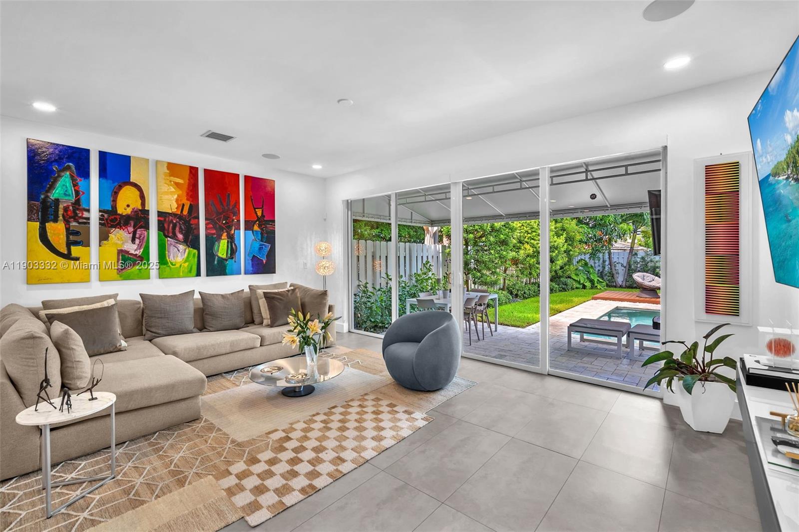 3167 Southwest 25th Street, Unit 1 Miami, FL 33133 - Photo 17 of 42 a living room with furniture and a large window