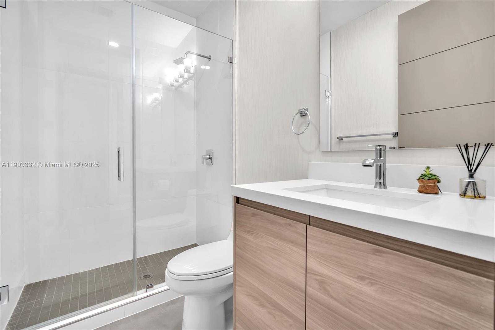 3167 Southwest 25th Street, Unit 1 Miami, FL 33133 - Photo 24 of 42 a bathroom with a sink a toilet and shower