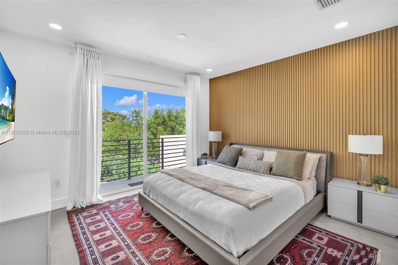 3167 Southwest 25th Street, Unit 1 Miami, FL 33133 - Photo 30 of 42 a bedroom with a bed and a lamp