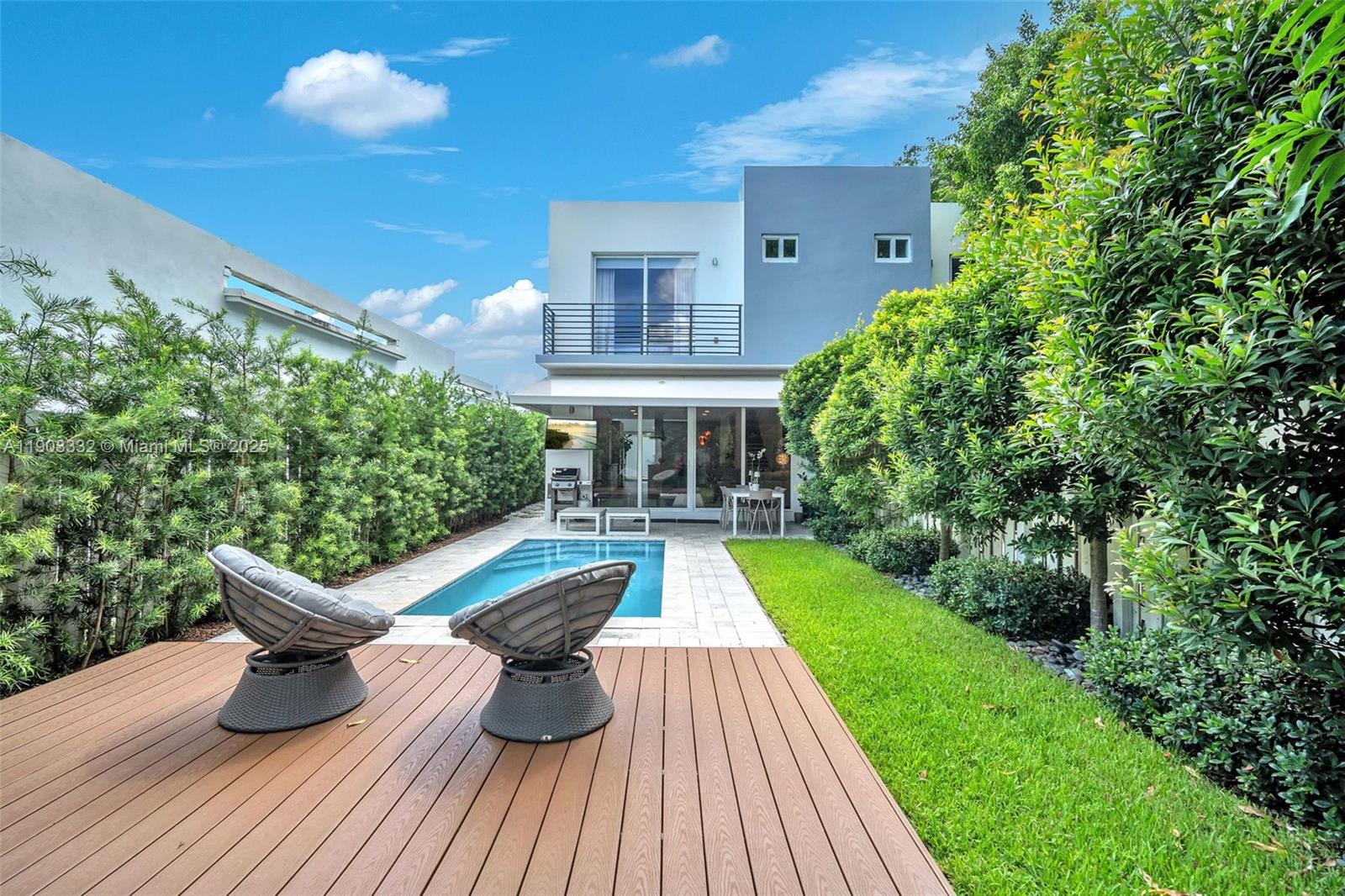 3167 Southwest 25th Street, Unit 1 Miami, FL 33133 - Photo 40 of 42 a view of a house with backyard sitting area and garden