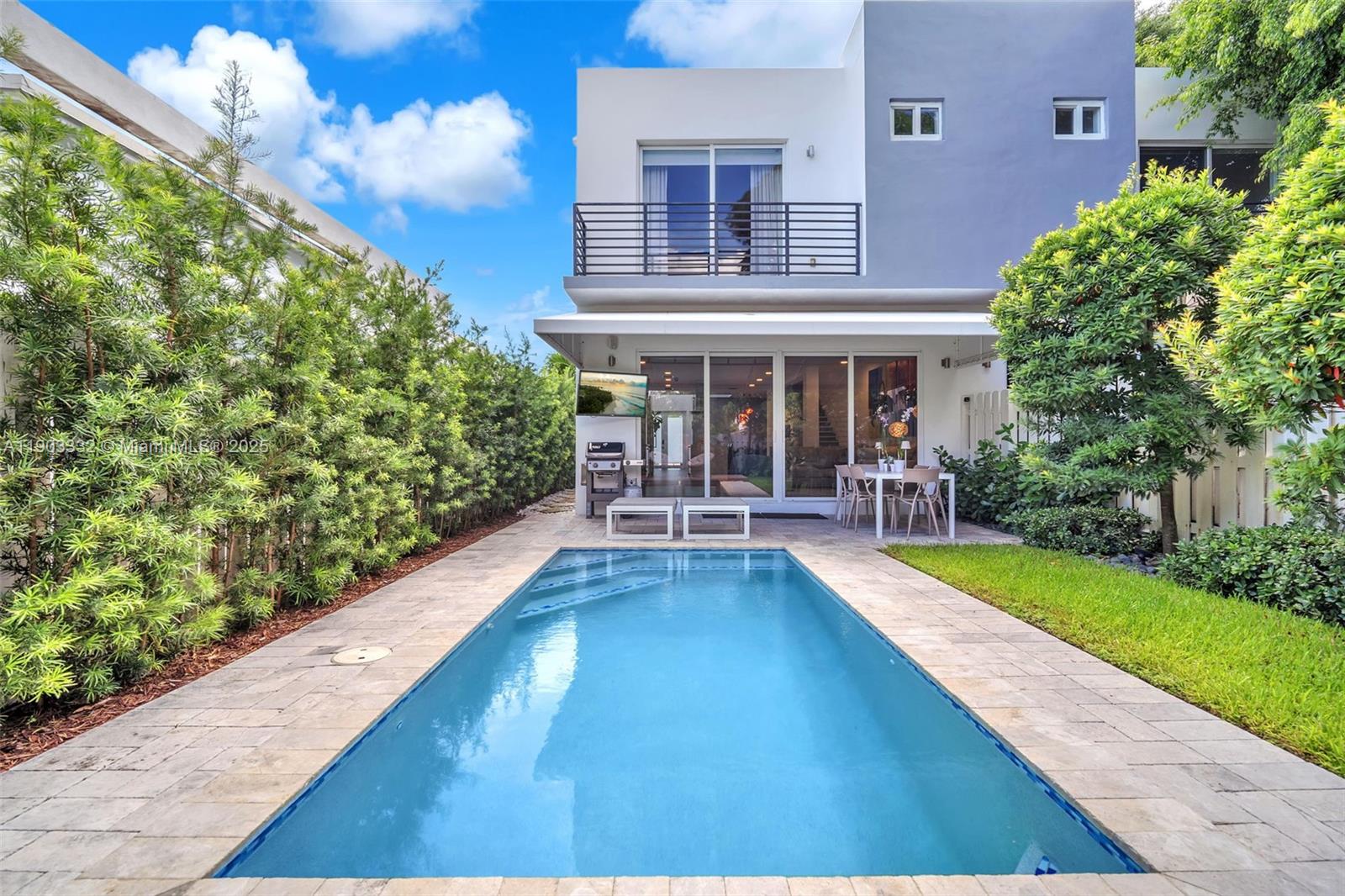 3167 Southwest 25th Street, Unit 1 Miami, FL 33133 - Photo 42 of 42 a view of house with swimming pool outdoor seating